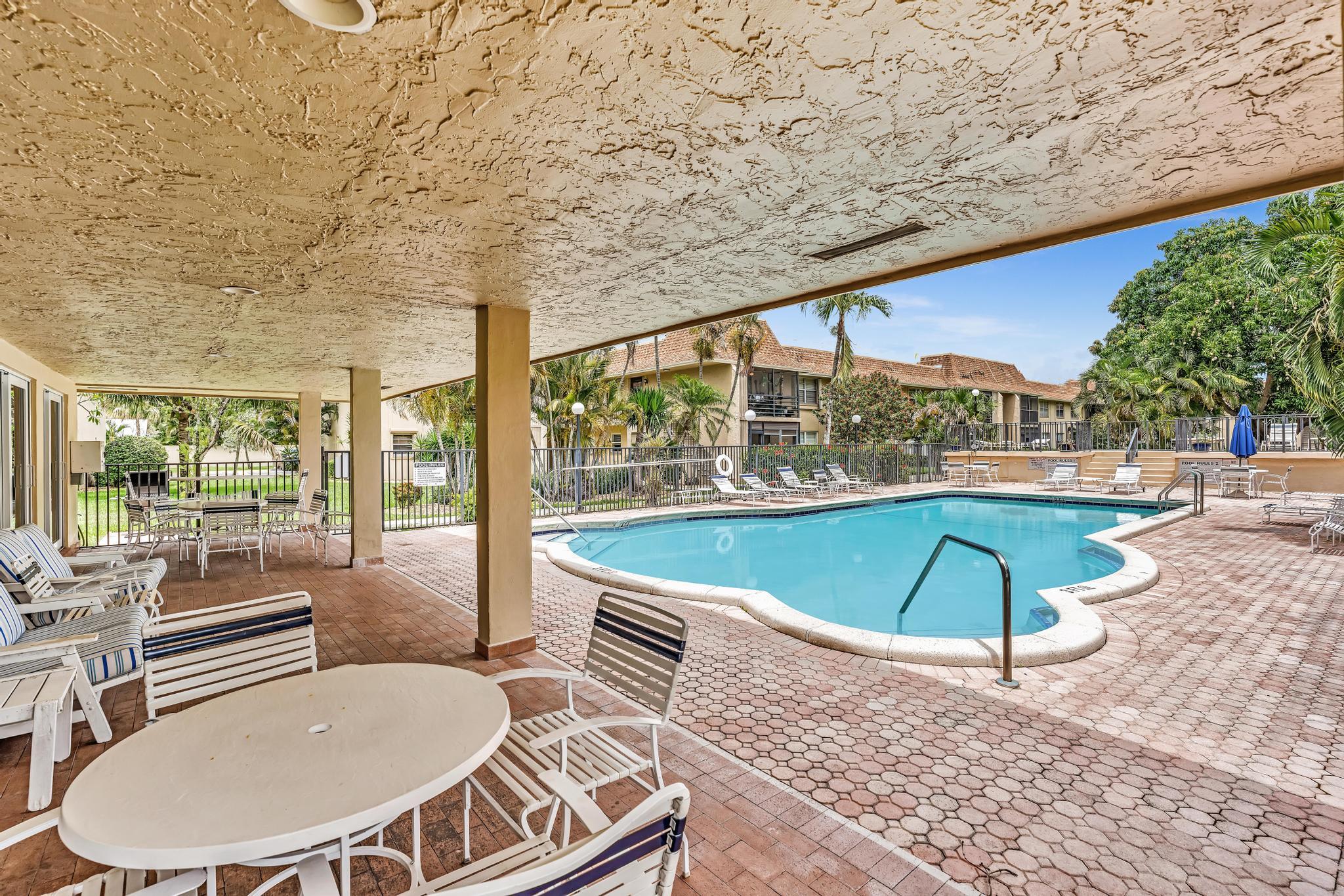 1291 Northwest 13th Street, Unit 445D Boca Raton, FL 33486 - Photo 3 of 50 a outdoor space with furniture