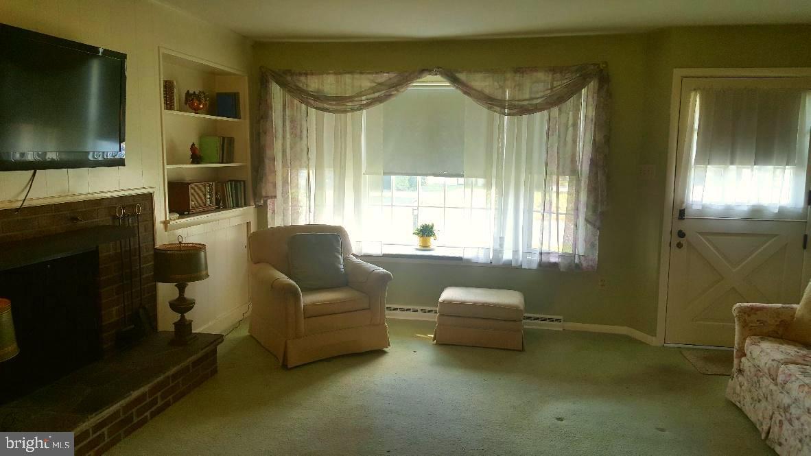 3615 Rosewood Road Reading, PA 19605 - Photo 5 of 22 Living room with bay window and gas fireplace