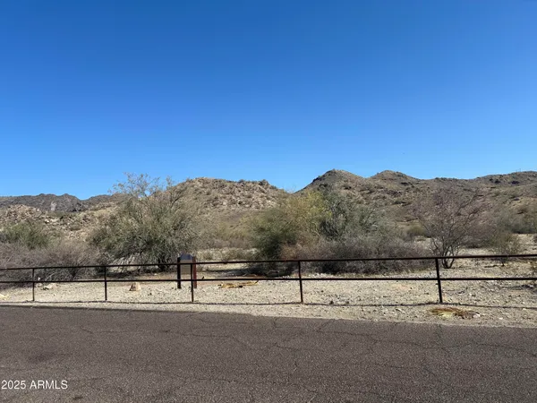 a view of a road with a building in the background