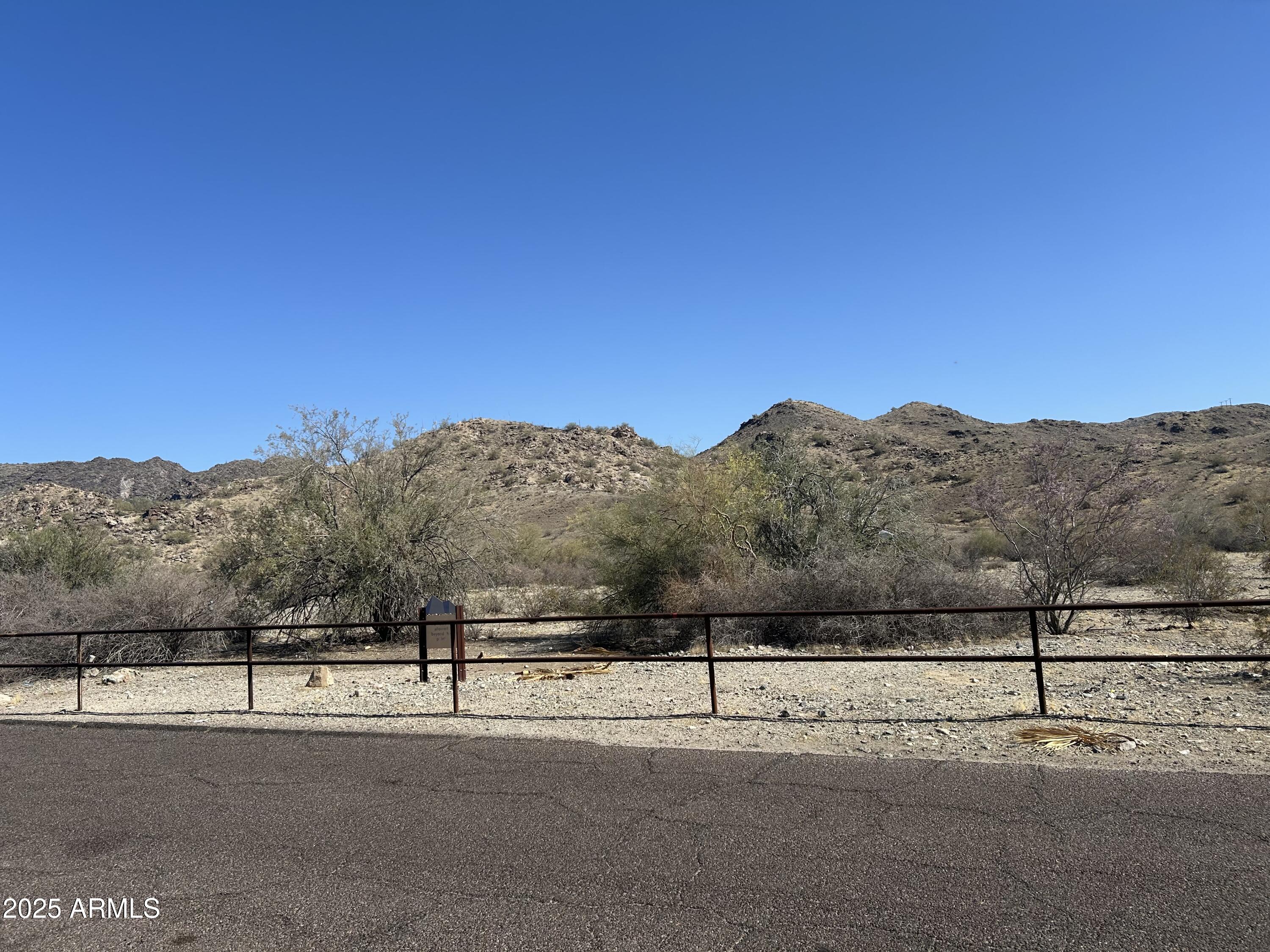 a view of a road with a building in the background