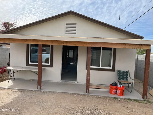a backyard of a house with seating space