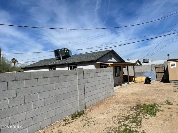 a view of a backyard of the house