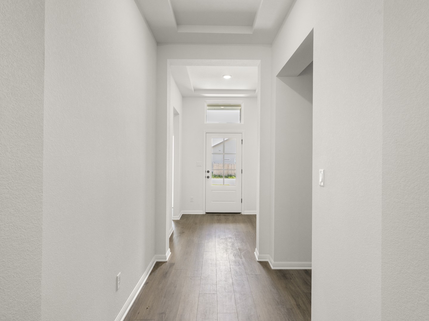 402 Judson Street Bertram, TX 78605 - Photo 3 of 27 a view of a hallway with wooden floor