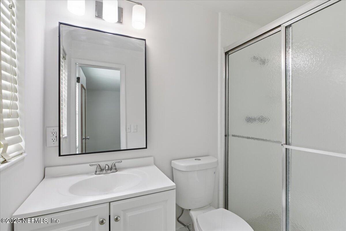 3767 Heath Road Jacksonville, FL 32277 - Photo 16 of 23 a bathroom with a sink toilet and shower