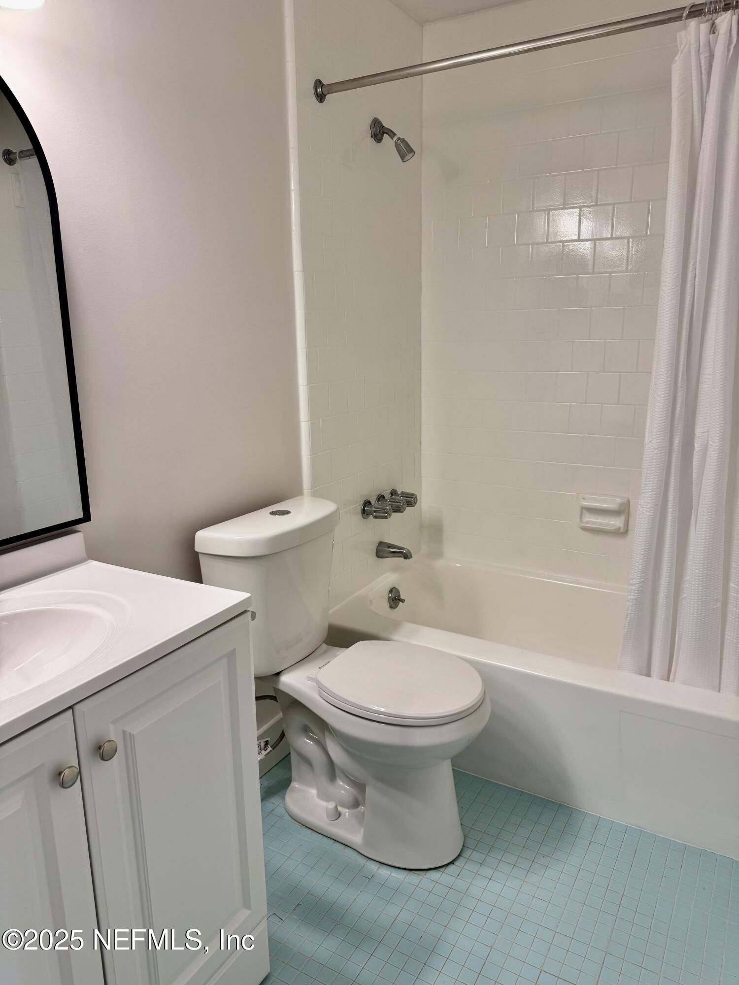 3767 Heath Road Jacksonville, FL 32277 - Photo 18 of 23 a white toilet sitting next to a bath tub