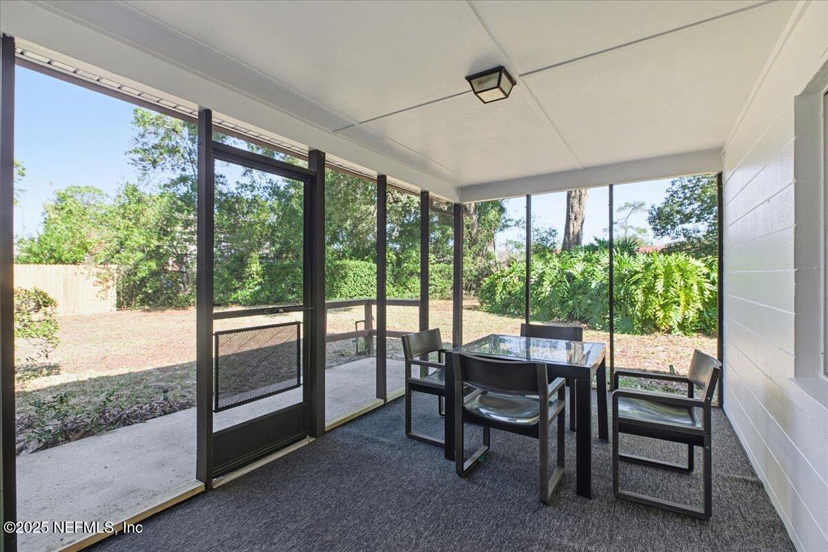 3767 Heath Road Jacksonville, FL 32277 - Photo 20 of 23 a view of a dining room with furniture window and outside view