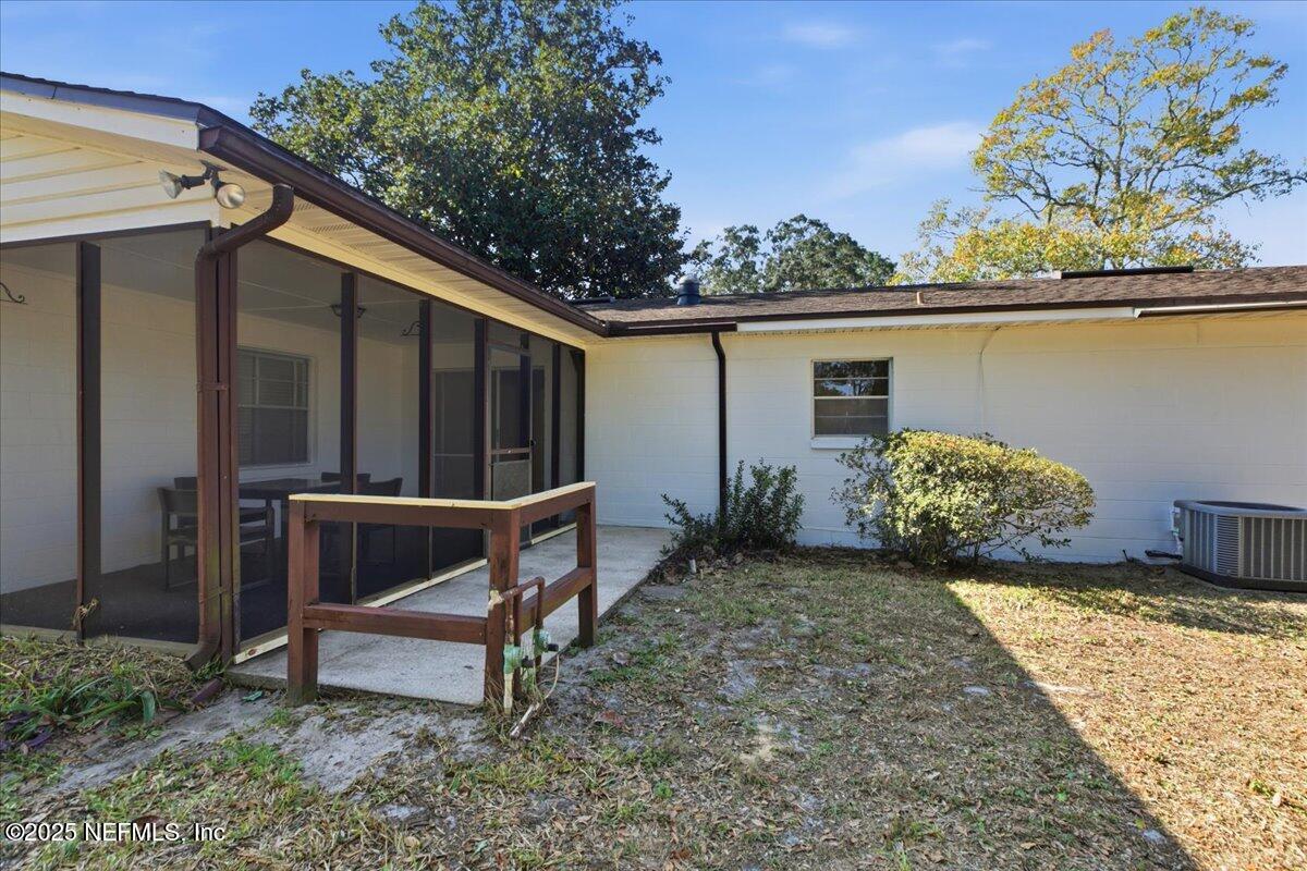 3767 Heath Road Jacksonville, FL 32277 - Photo 21 of 23 a view of backyard with seating area and trees