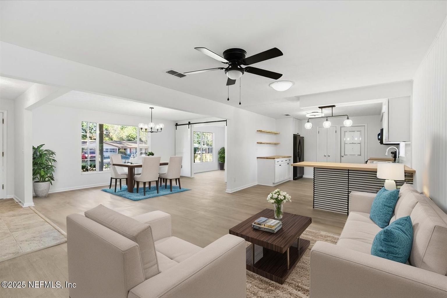 3767 Heath Road Jacksonville, FL 32277 - Photo 4 of 23 a living room with furniture and a large window