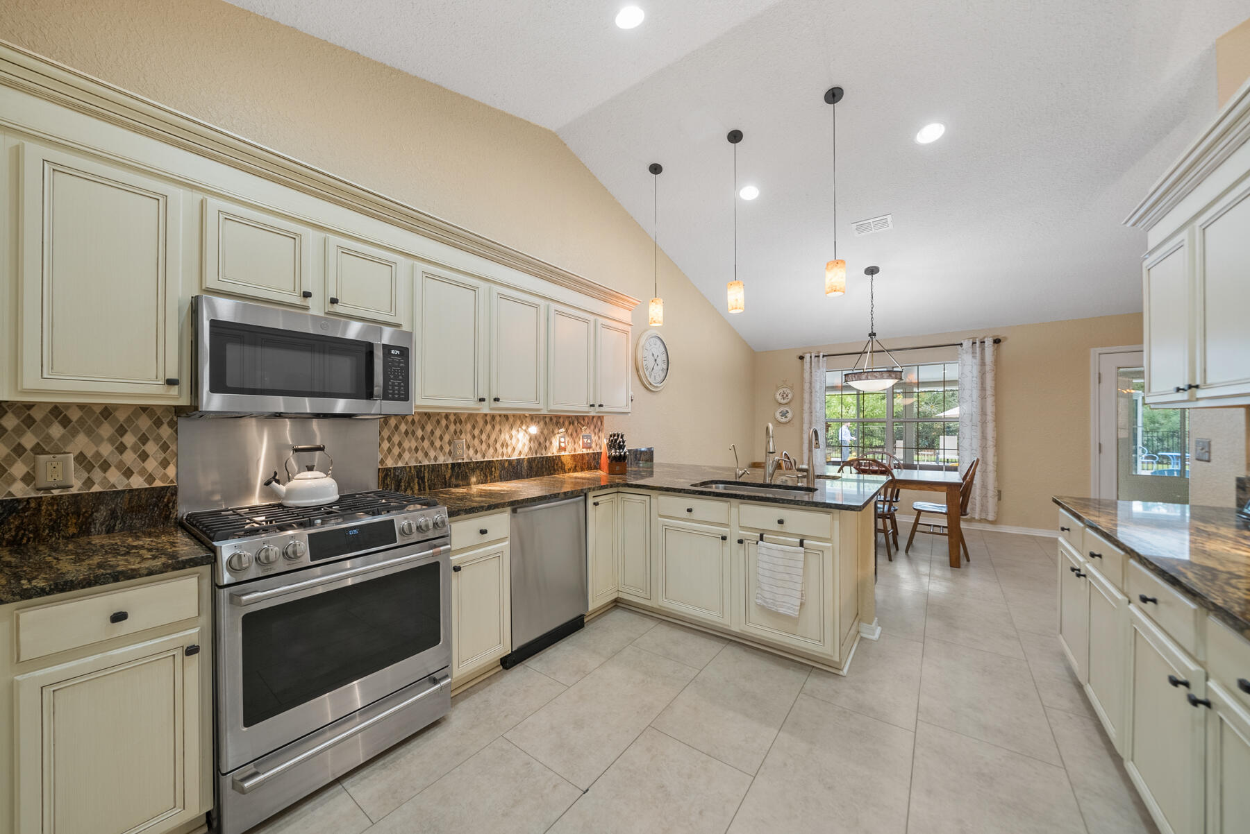 130 Shipwreck Road Santa Rosa Beach, FL 32459 - Photo 14 of 76 a kitchen with granite countertop appliances cabinets and a sink