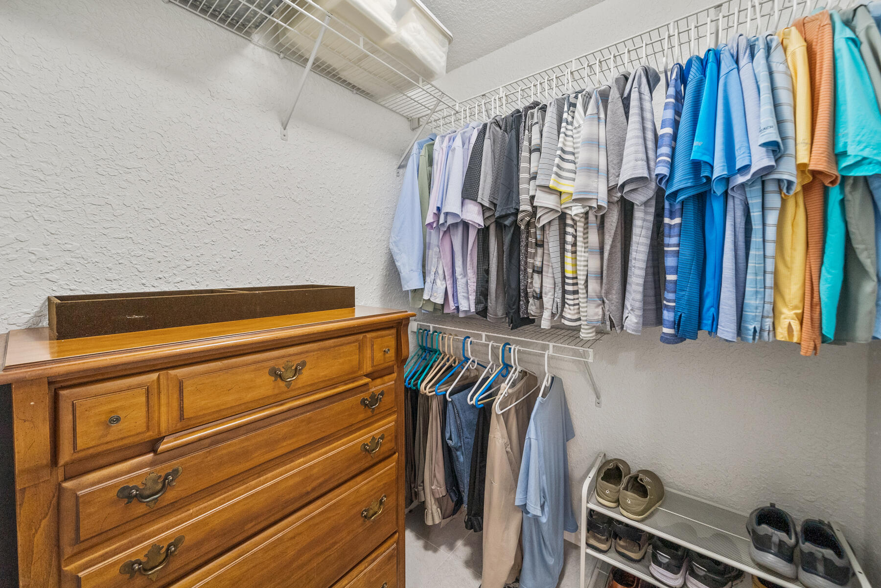 130 Shipwreck Road Santa Rosa Beach, FL 32459 - Photo 27 of 76 a view of walk in closet with clothes and shoes
