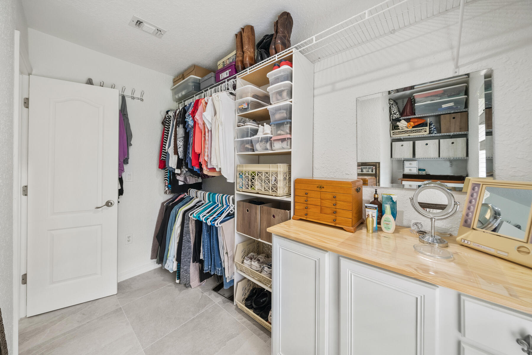 130 Shipwreck Road Santa Rosa Beach, FL 32459 - Photo 28 of 76 a view of walk in closet with clothes and shoes