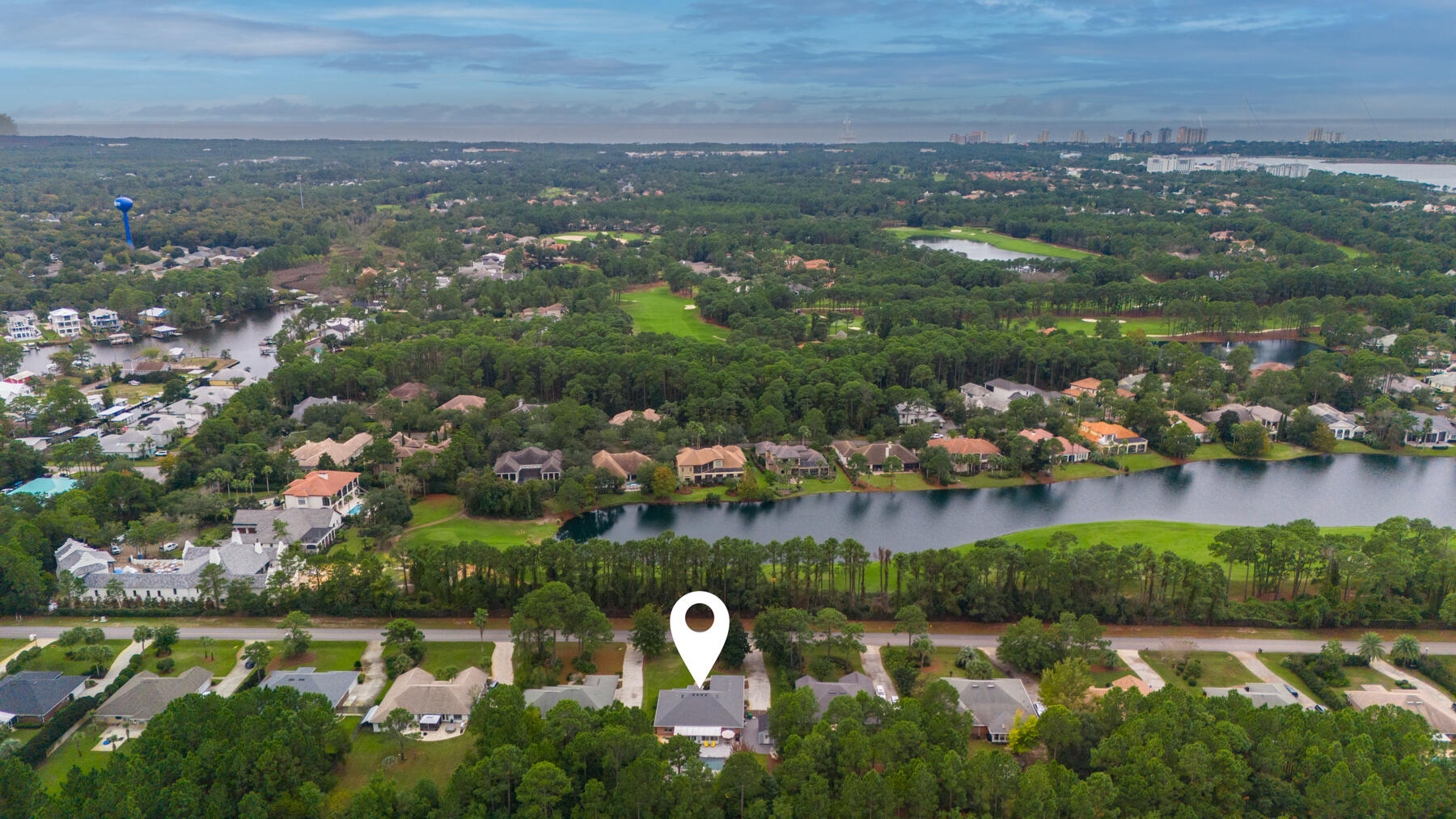 130 Shipwreck Road Santa Rosa Beach, FL 32459 - Photo 32 of 76 an aerial view of residential houses with outdoor space and lake view
