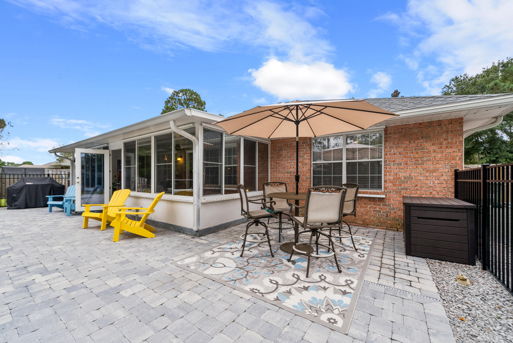 130 Shipwreck Road Santa Rosa Beach, FL 32459 - Photo 56 of 76 a view of a patio with a table and chairs under an umbrella