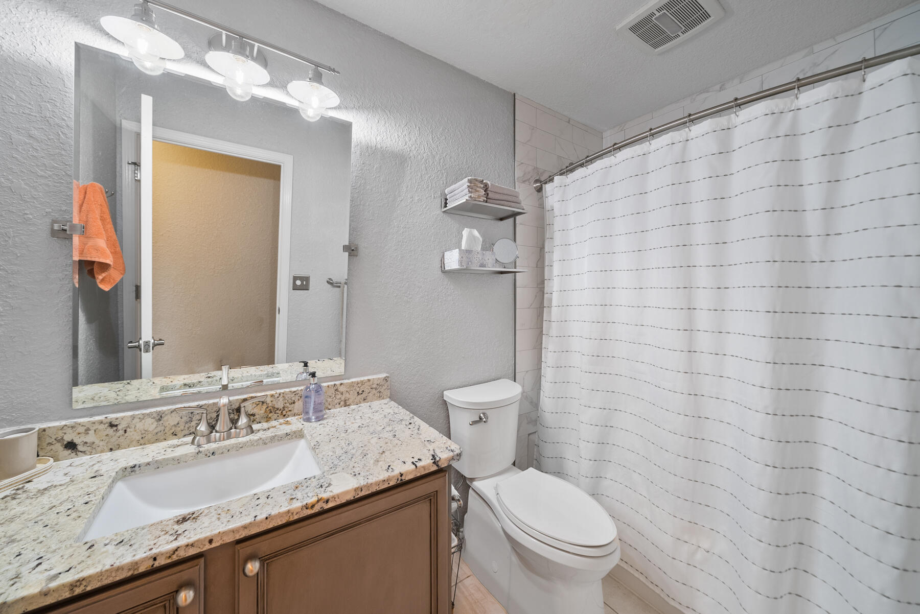 130 Shipwreck Road Santa Rosa Beach, FL 32459 - Photo 67 of 76 a bathroom with a granite countertop sink a toilet and a mirror