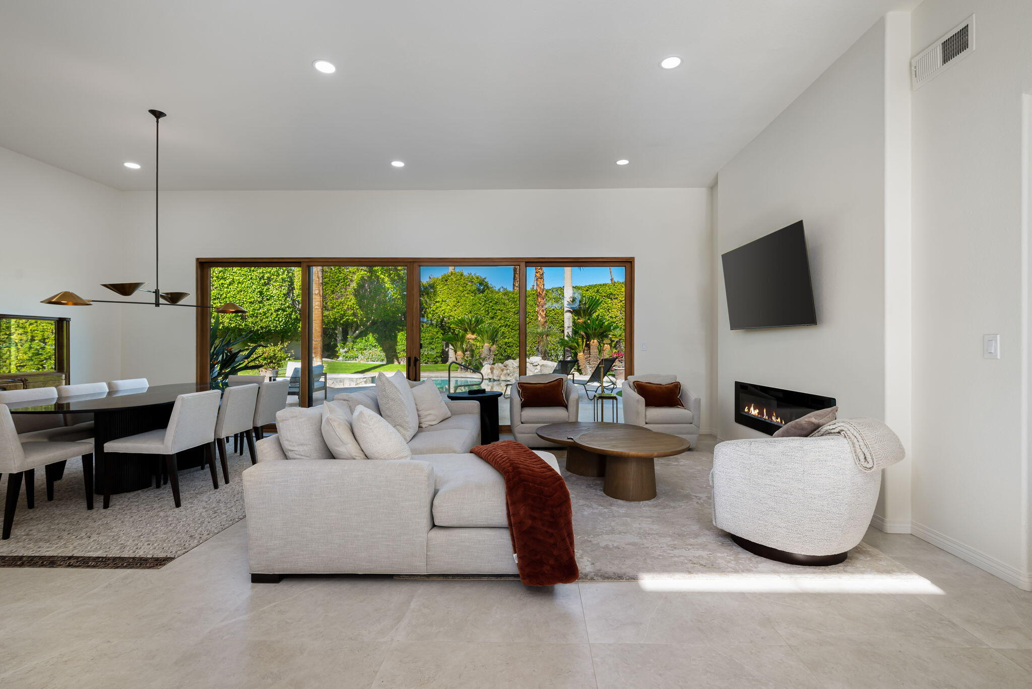 8 Park Mirage Lane Rancho Mirage, CA 92270 - Photo 12 of 51 a living room with fireplace furniture and a large window