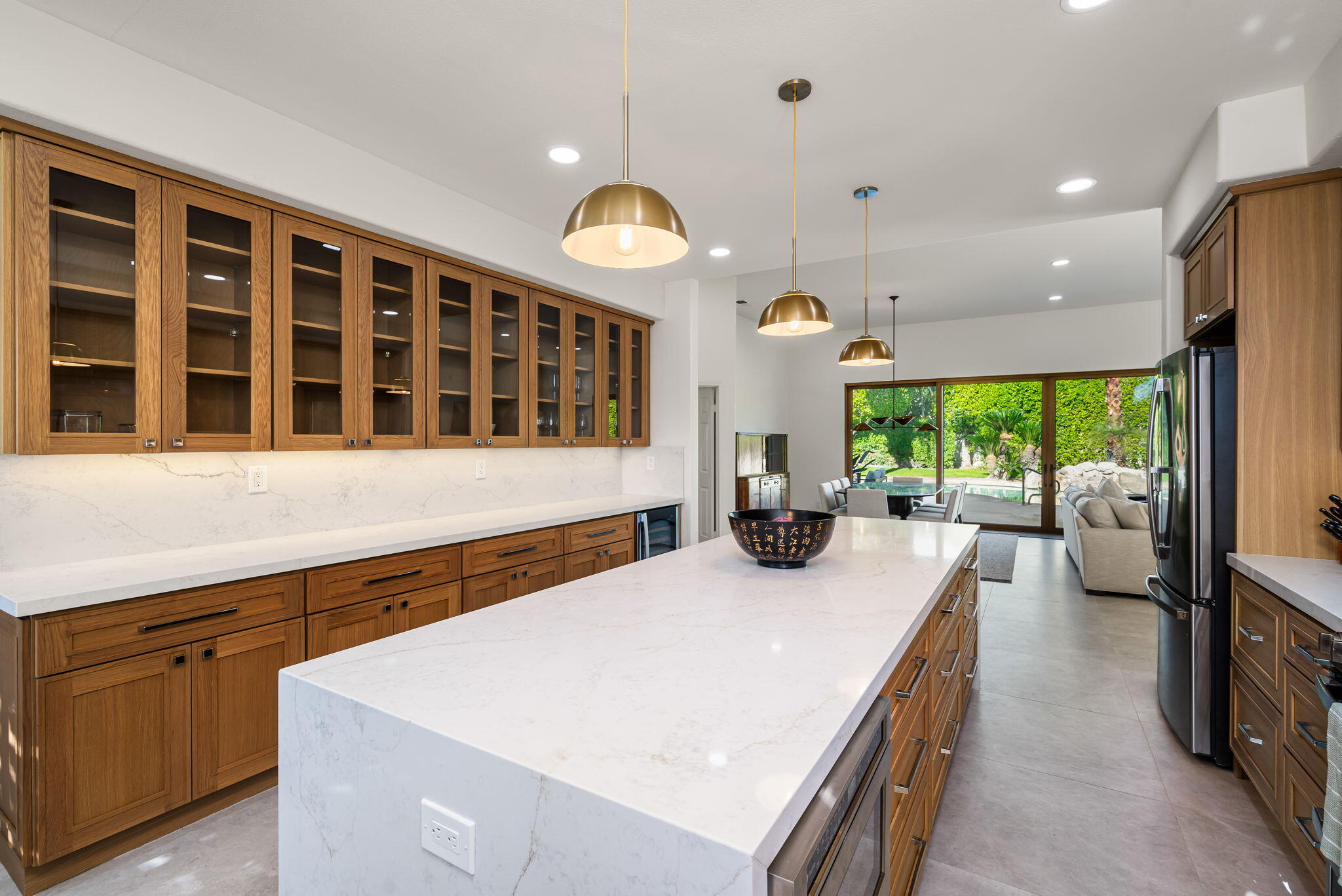 8 Park Mirage Lane Rancho Mirage, CA 92270 - Photo 22 of 51 a large kitchen with stainless steel appliances a large counter top a stove and a sink