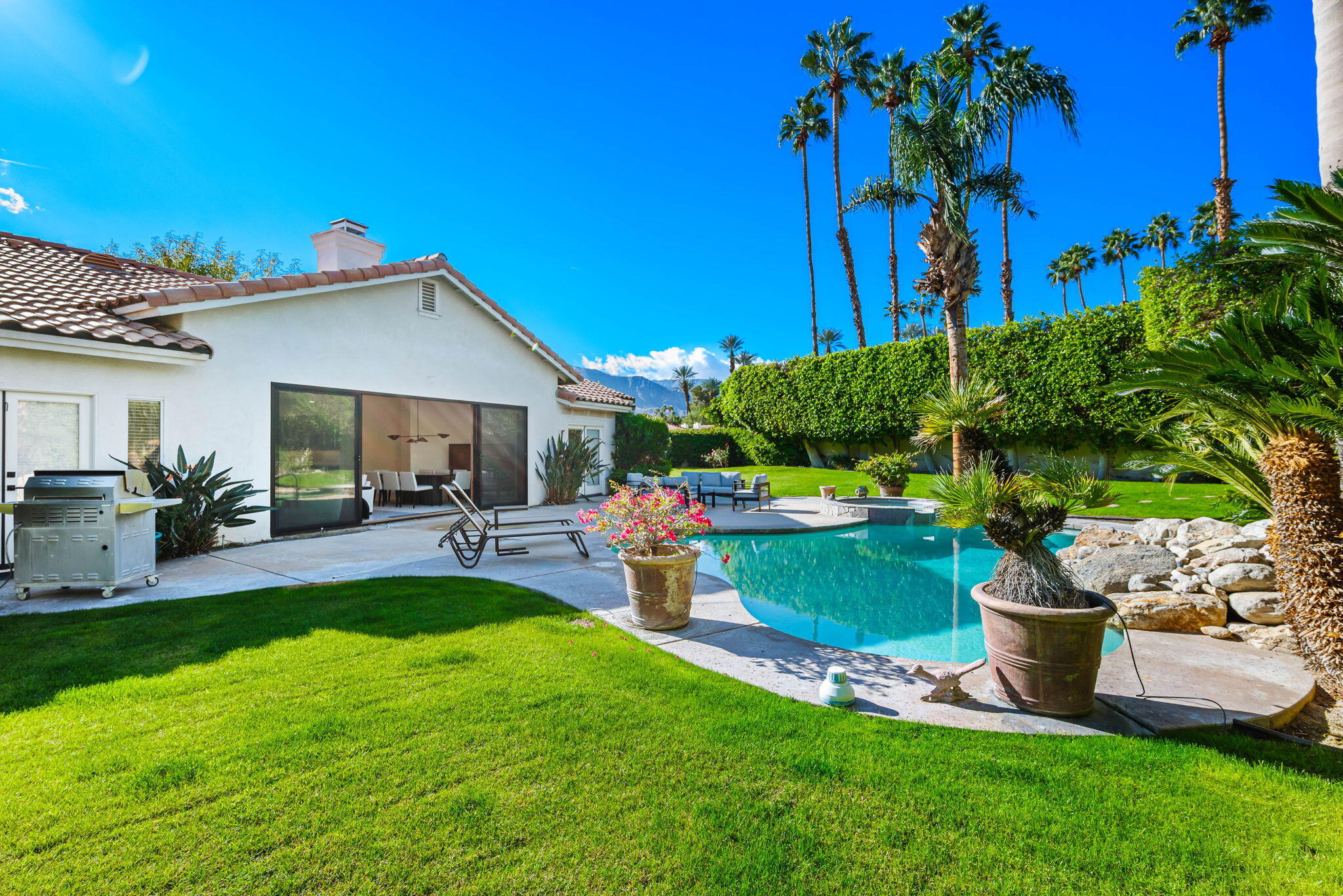 8 Park Mirage Lane Rancho Mirage, CA 92270 - Photo 29 of 51 a view of a backyard with plants and a patio