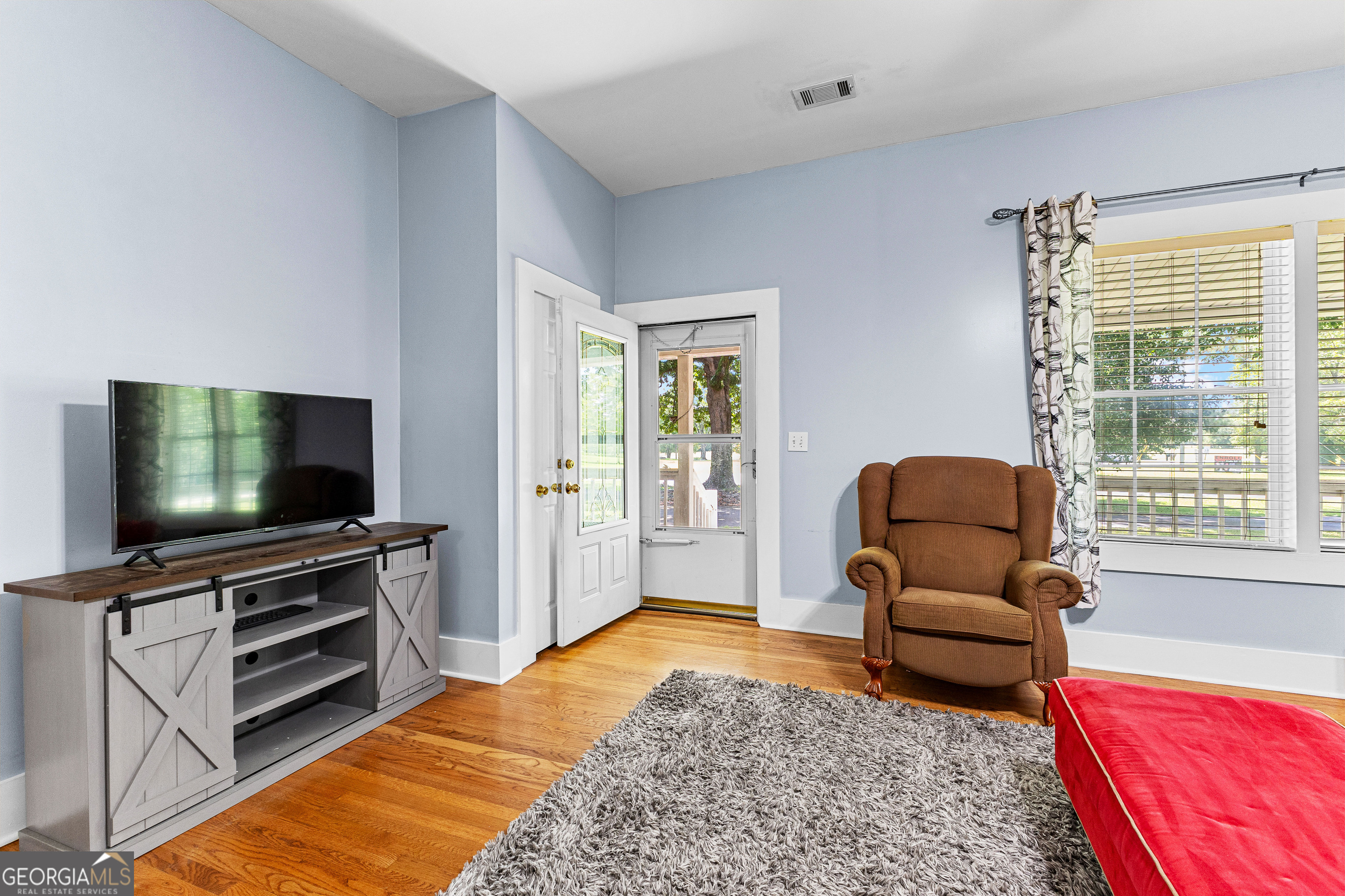 20 Conkle Road Hampton, GA 30228 - Photo 11 of 56 a living room with furniture and a flat screen tv