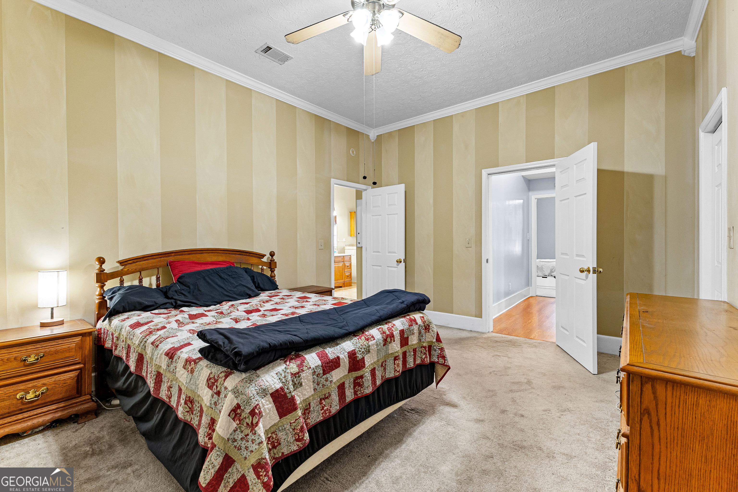 20 Conkle Road Hampton, GA 30228 - Photo 17 of 56 a bedroom with a bed and a chandelier