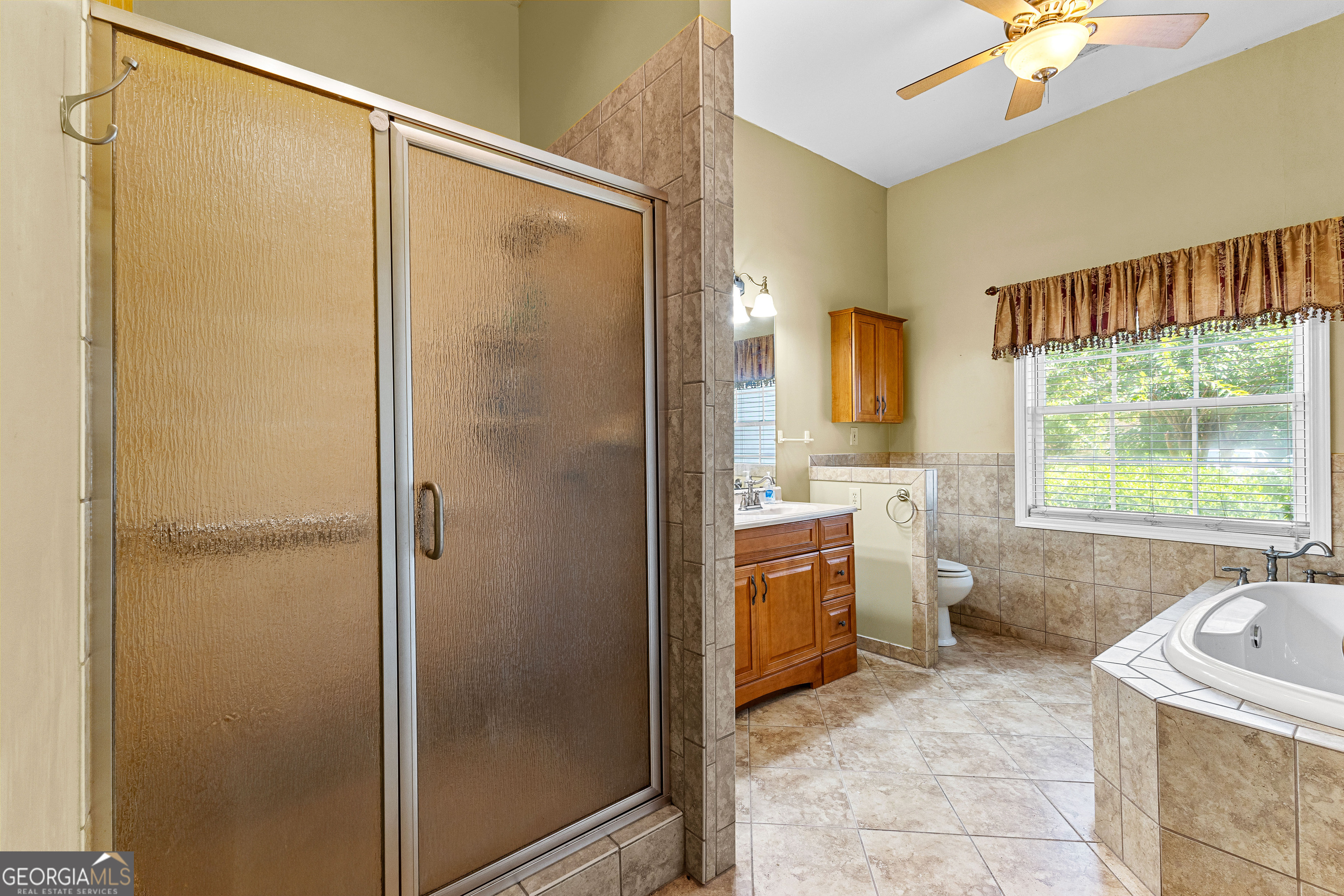 20 Conkle Road Hampton, GA 30228 - Photo 18 of 56 a bathroom with a tub sink and mirror