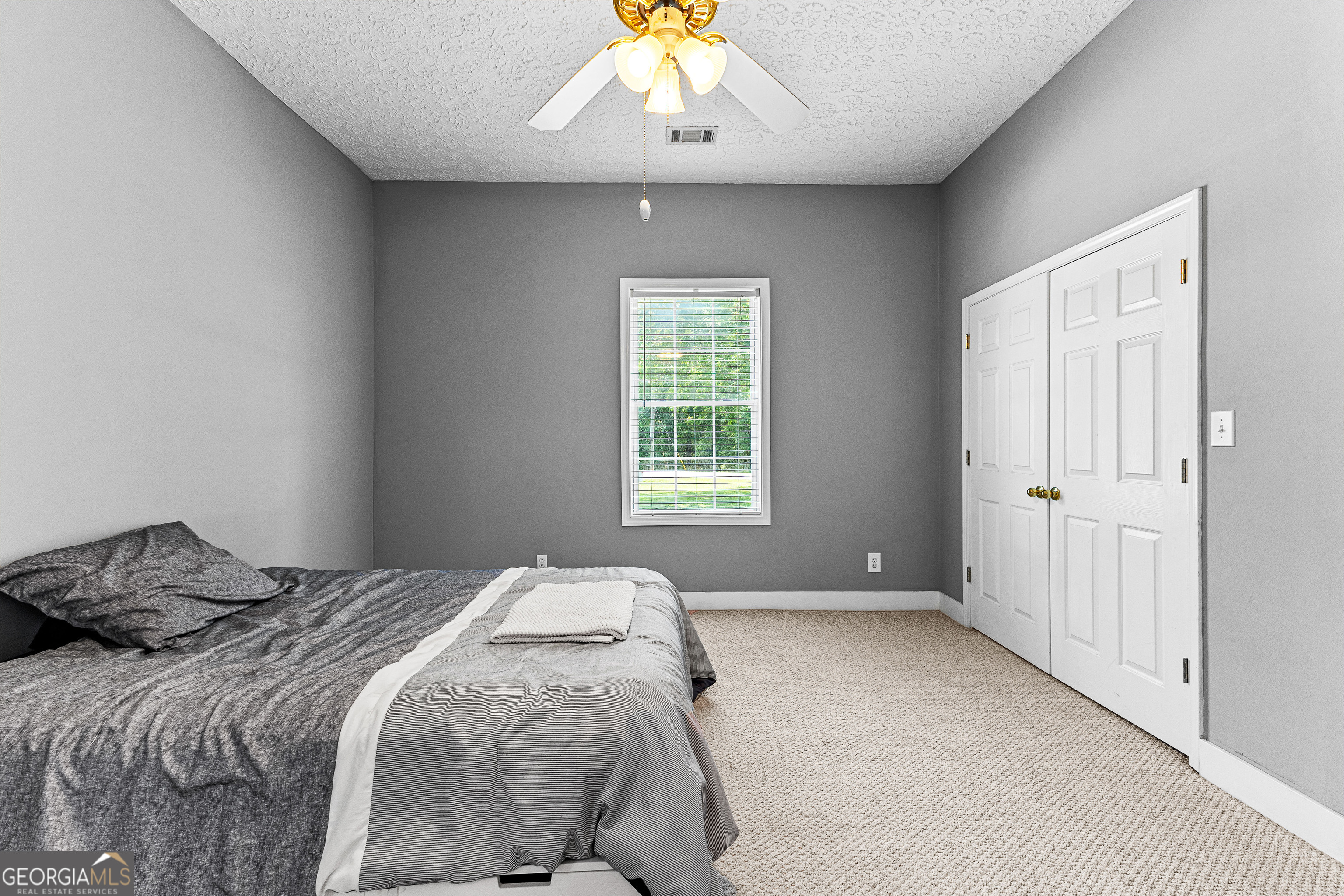 20 Conkle Road Hampton, GA 30228 - Photo 21 of 56 a bedroom with a large bed and a window