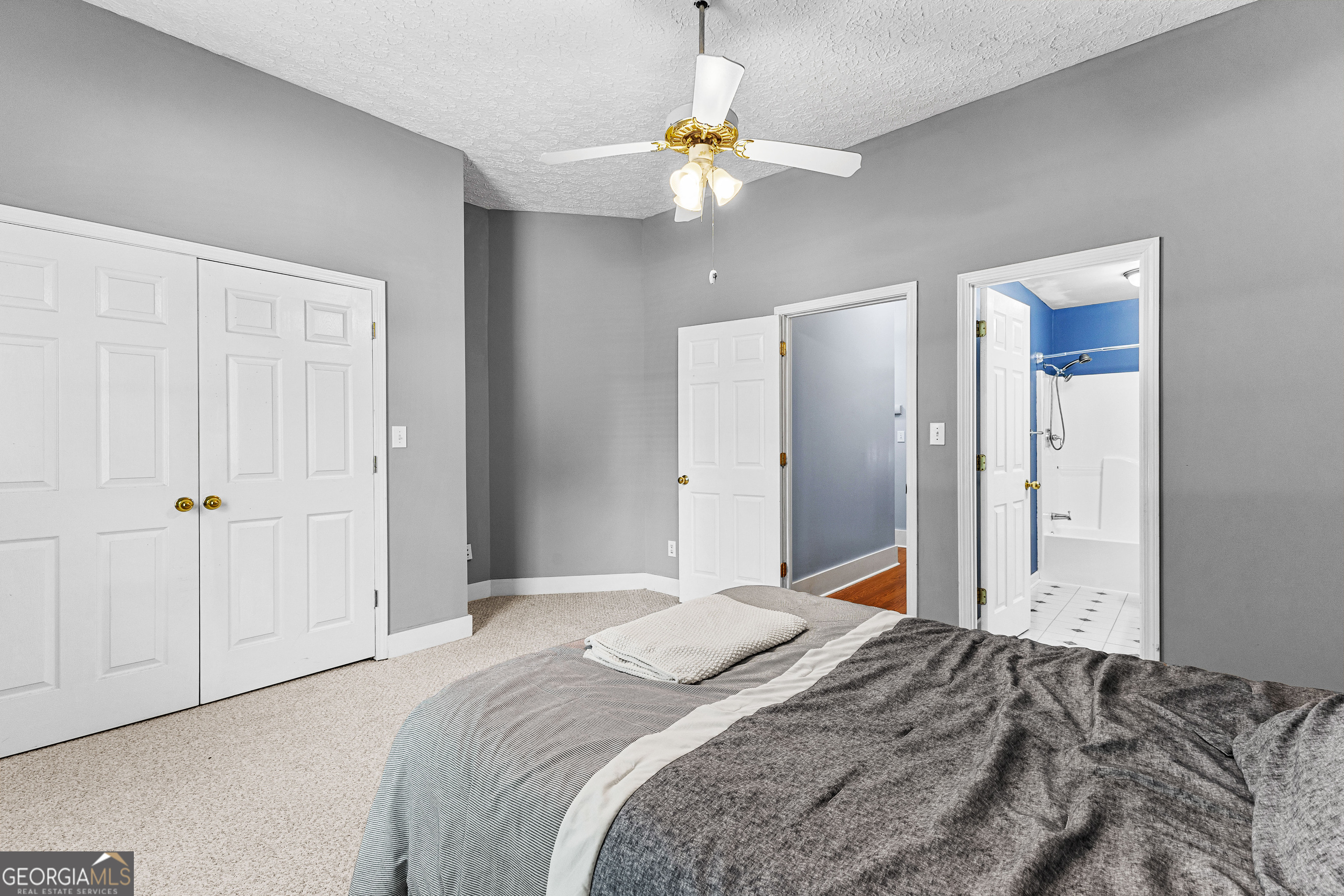 20 Conkle Road Hampton, GA 30228 - Photo 22 of 56 a bedroom with a bed and a chandelier