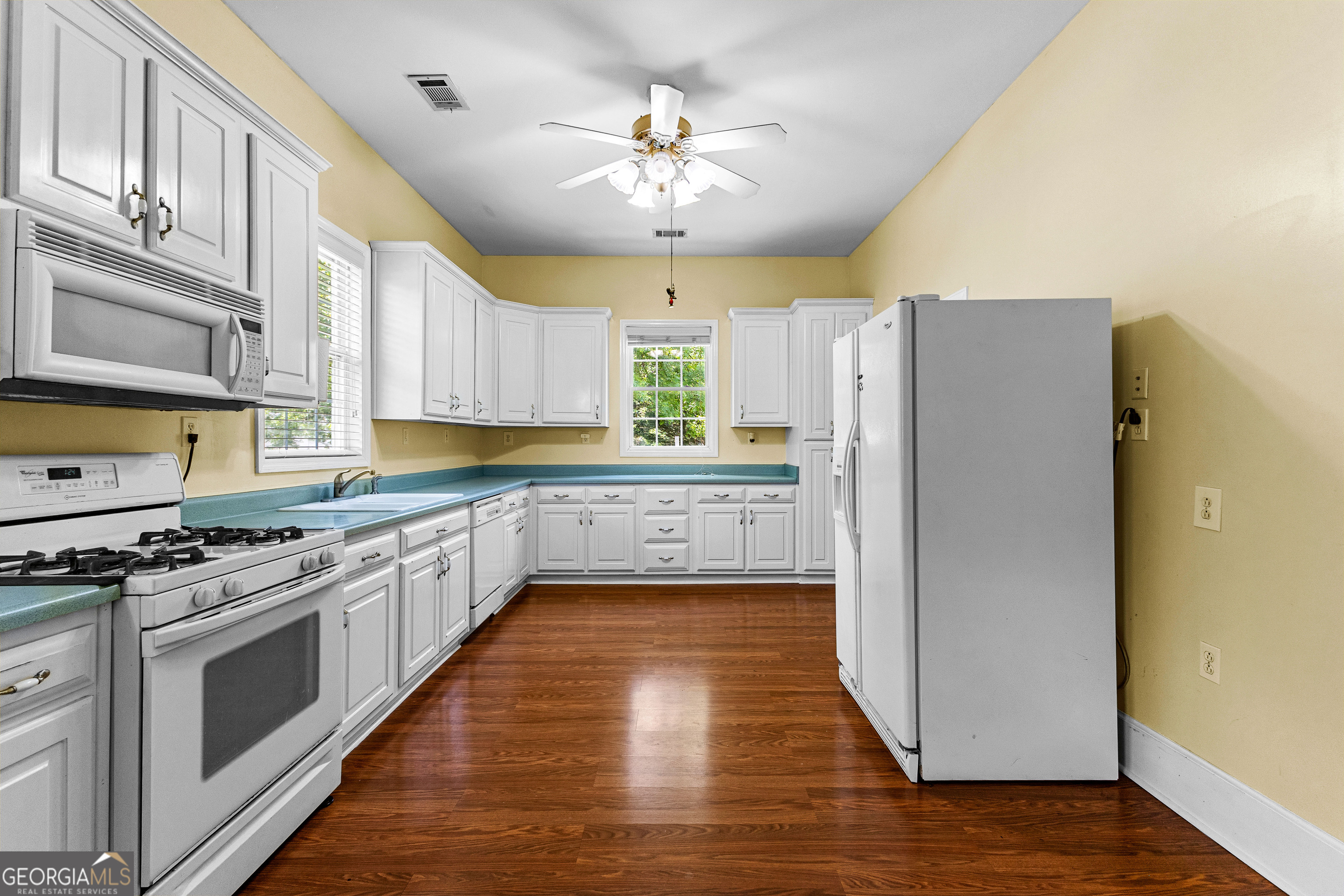 20 Conkle Road Hampton, GA 30228 - Photo 30 of 56 a kitchen with stainless steel appliances a stove a refrigerator and a sink