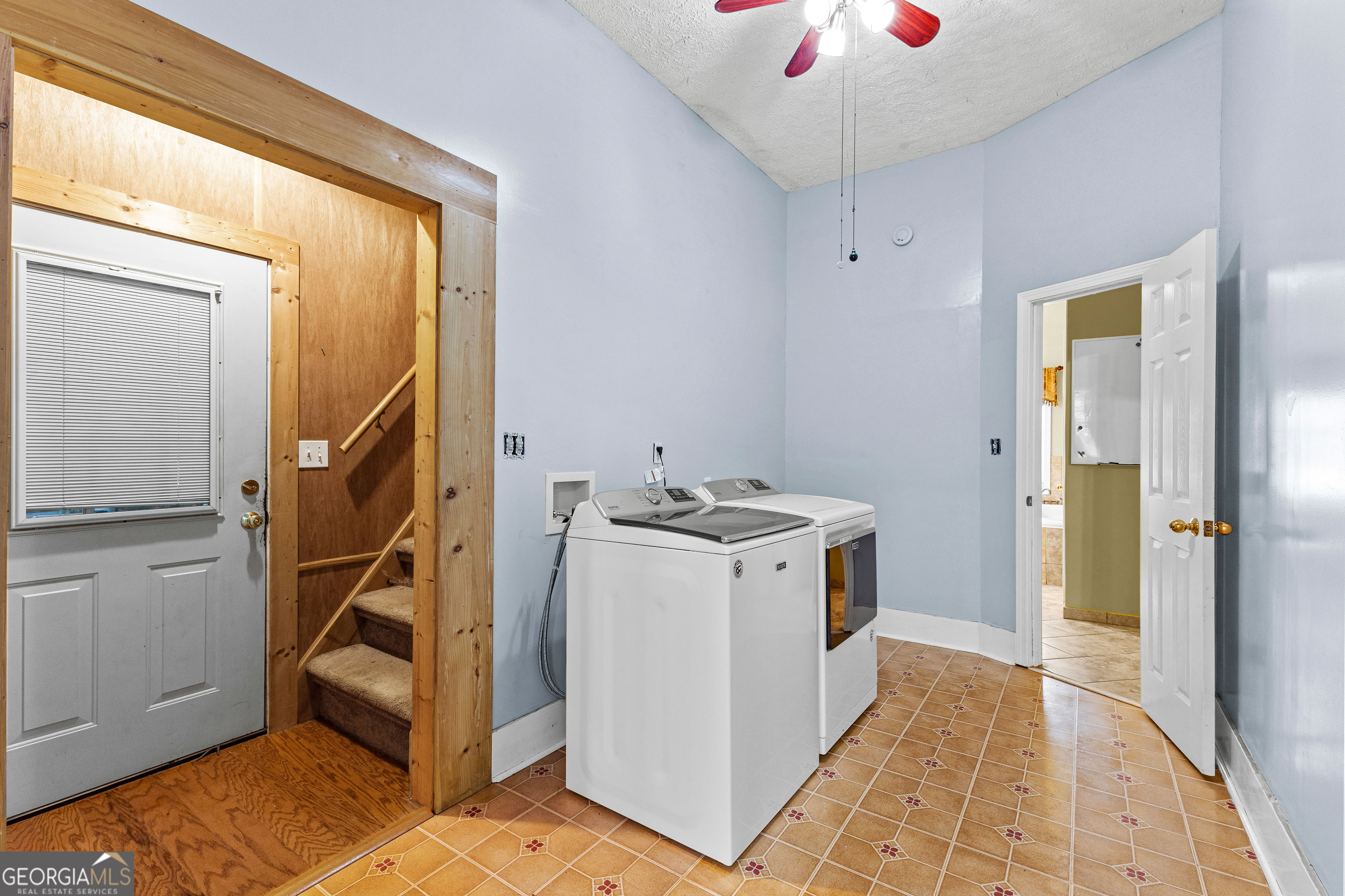 20 Conkle Road Hampton, GA 30228 - Photo 35 of 56 a utility room with cabinets and wooden floors