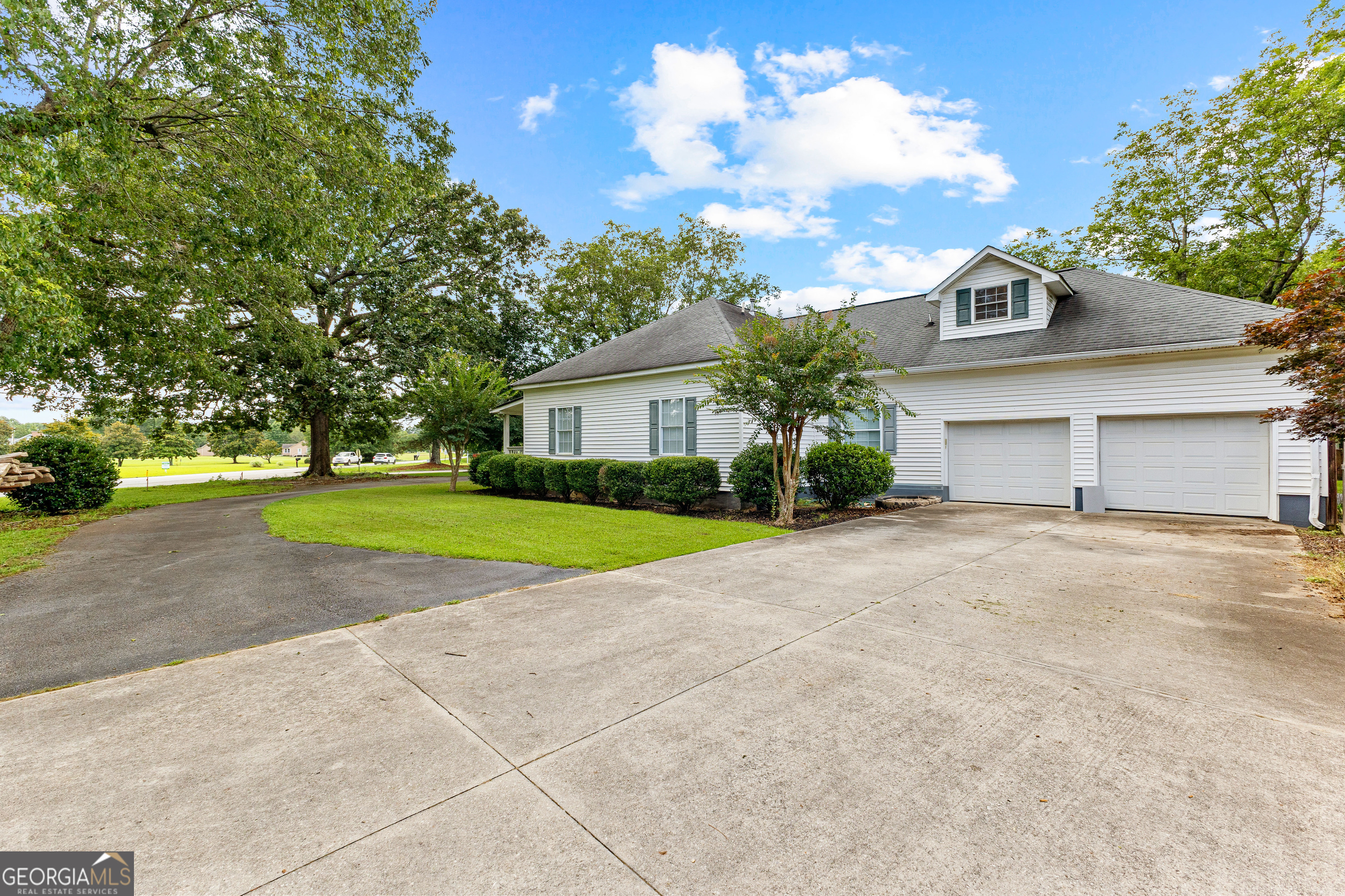 20 Conkle Road Hampton, GA 30228 - Photo 4 of 56 a view of a house with a yard and garage