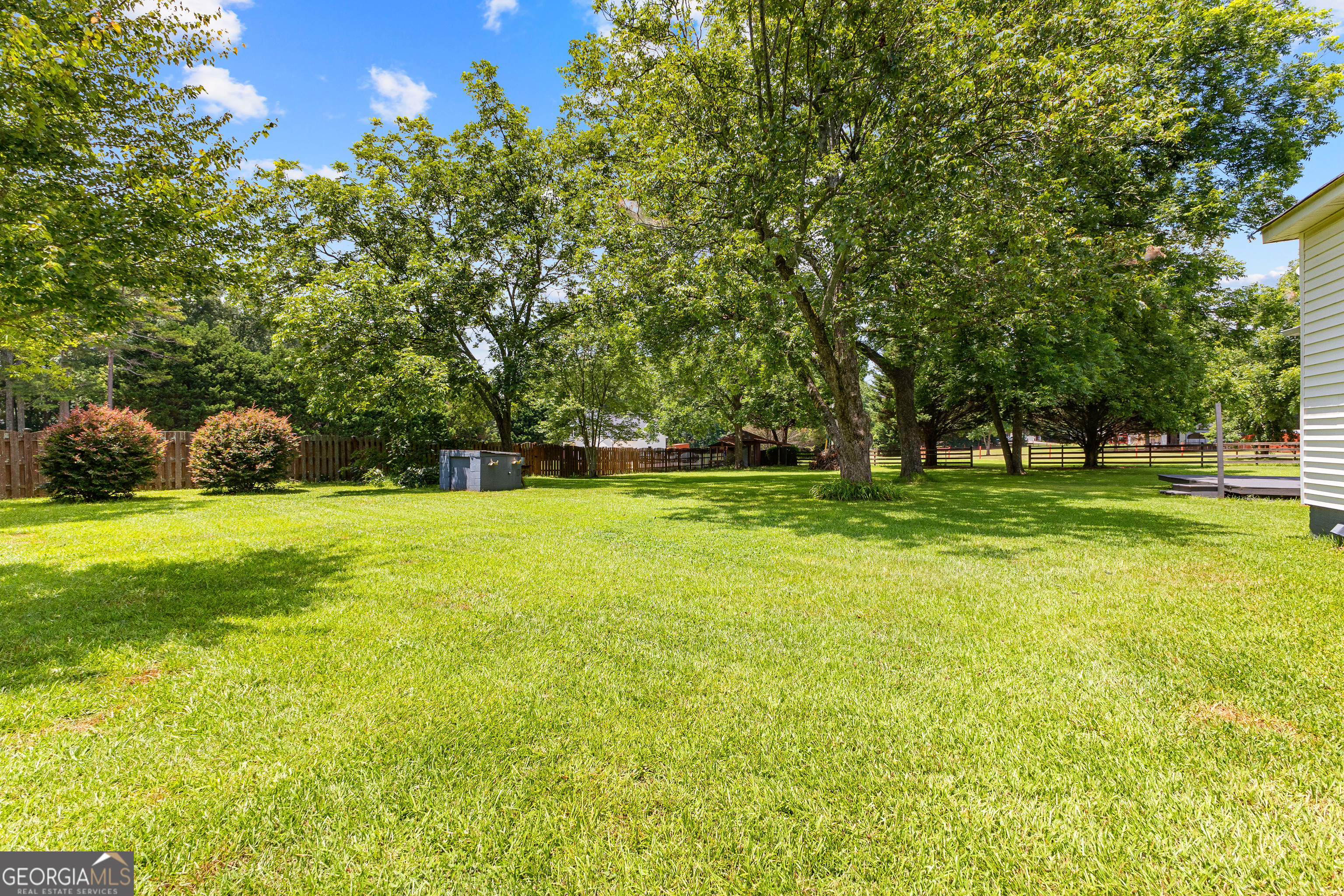 20 Conkle Road Hampton, GA 30228 - Photo 49 of 56 a view of green field with trees in the background