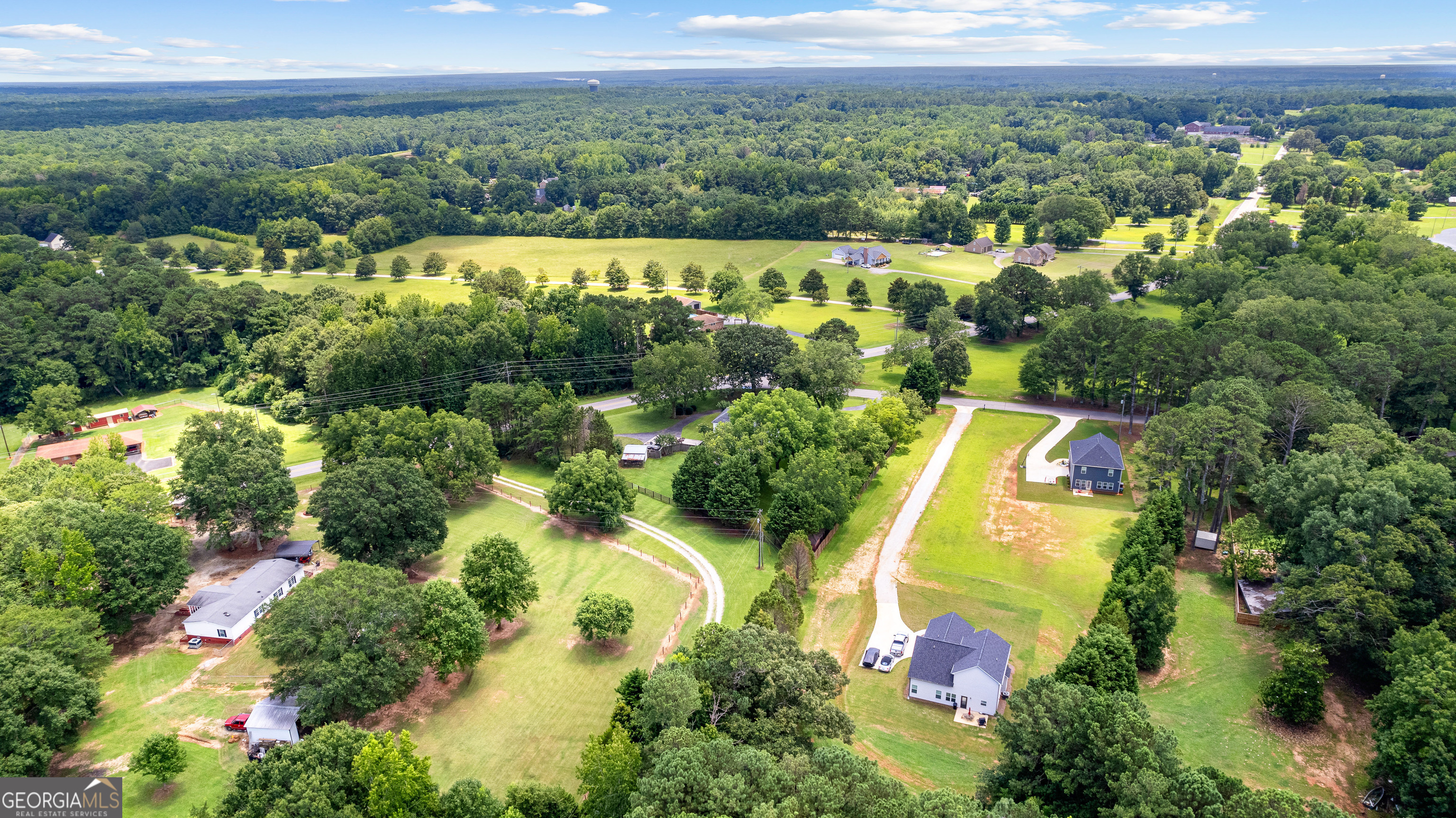 20 Conkle Road Hampton, GA 30228 - Photo 52 of 56 an aerial view of a house with a yard and lake view