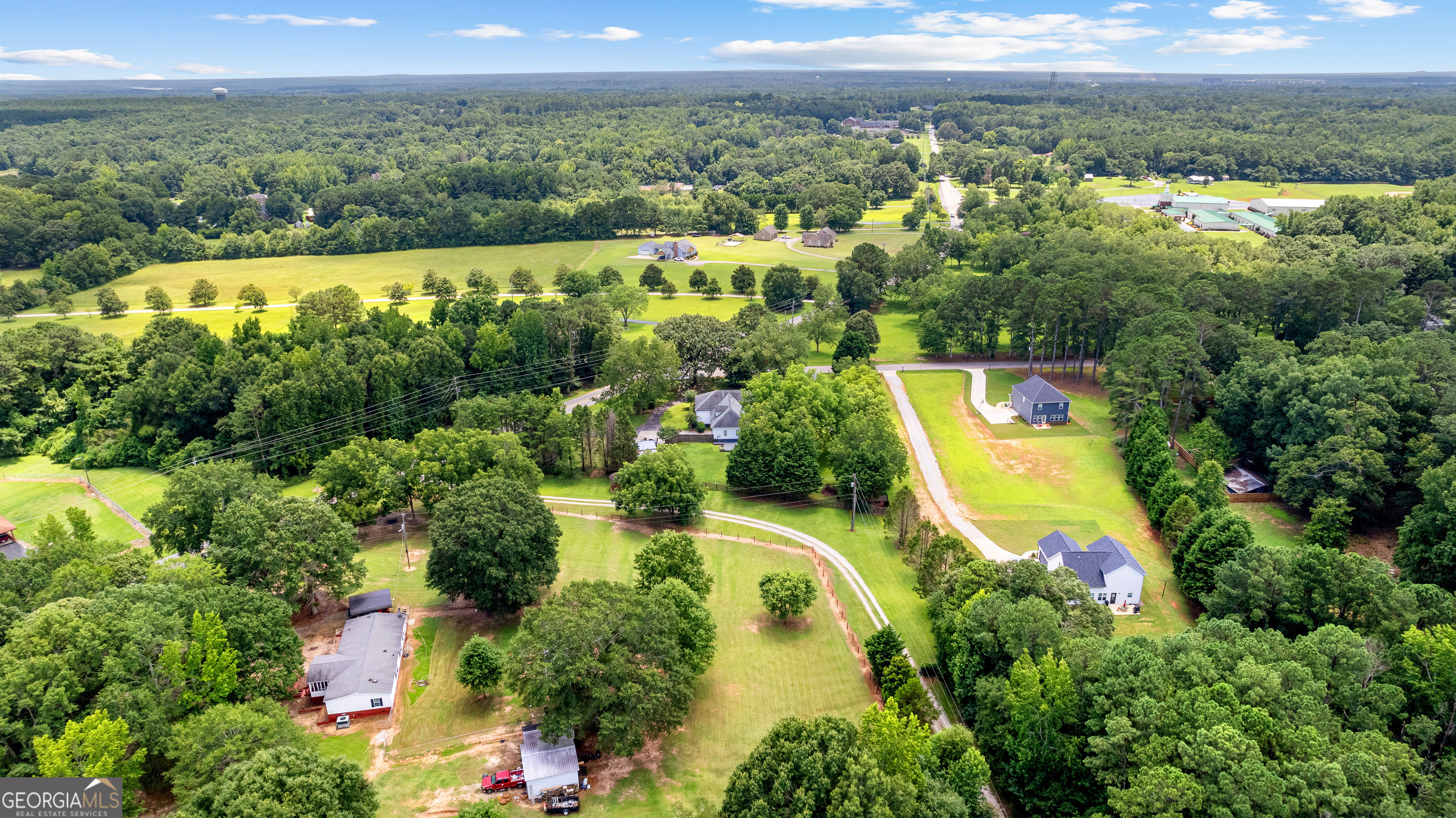 20 Conkle Road Hampton, GA 30228 - Photo 55 of 56 an aerial view of a residential houses with a yard and lake view