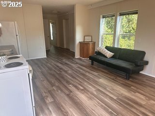 5000 Northeast Stephens Street, Unit 39 Roseburg, OR 97470 - Photo 2 of 9 a living room with furniture and a large window