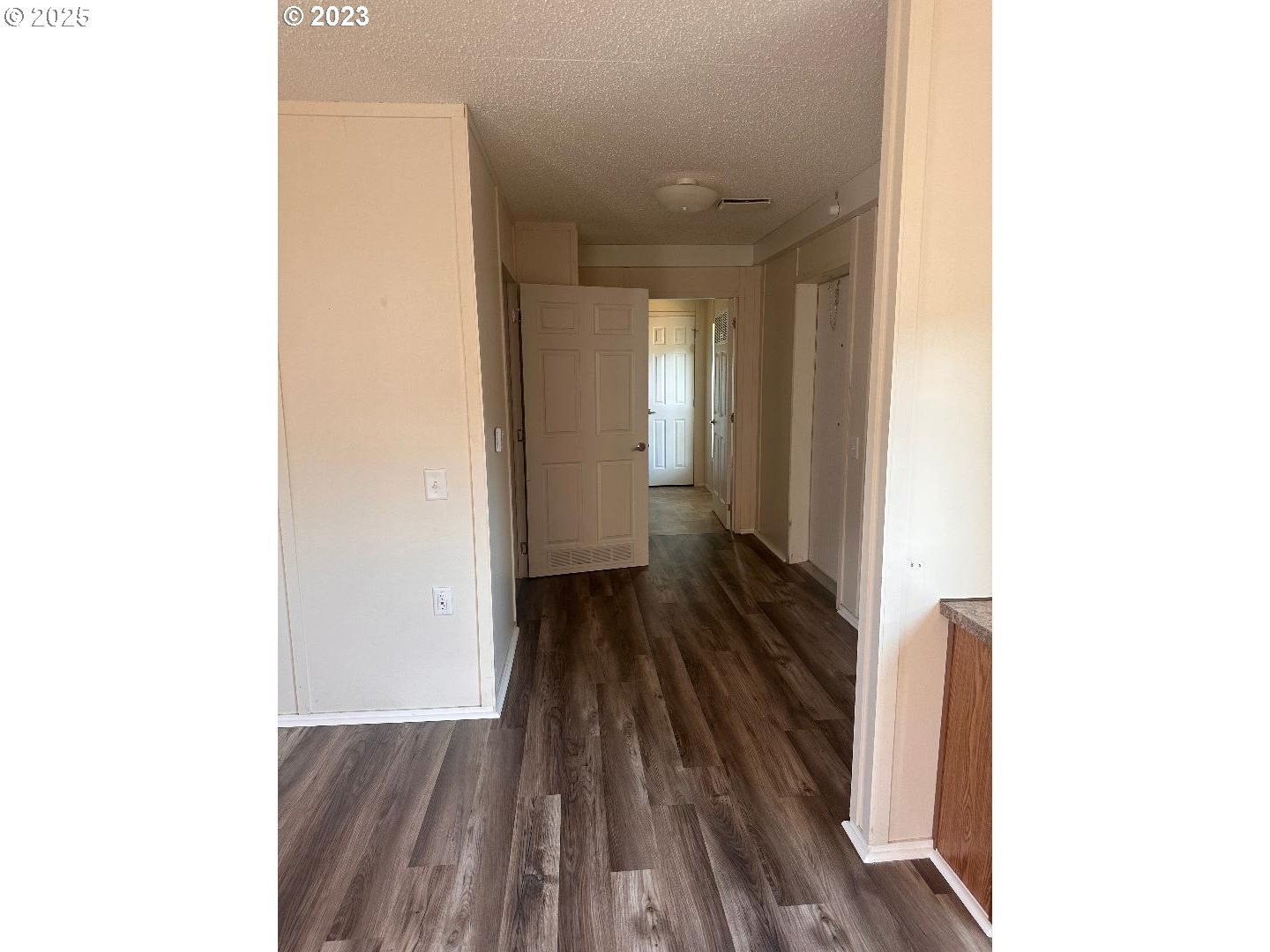 5000 Northeast Stephens Street, Unit 39 Roseburg, OR 97470 - Photo 4 of 9 a view of a hallway with wooden floor