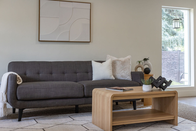 1552 Sumac Drive Logan, UT 84321 - Photo 7 of 72 Bright interior space featuring a large picture window, light-toned walls, and a contemporary area rug