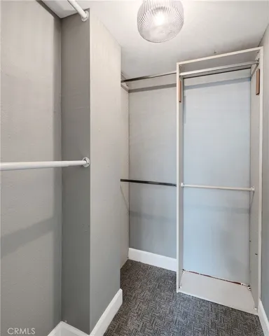 a view of an empty walk in closet