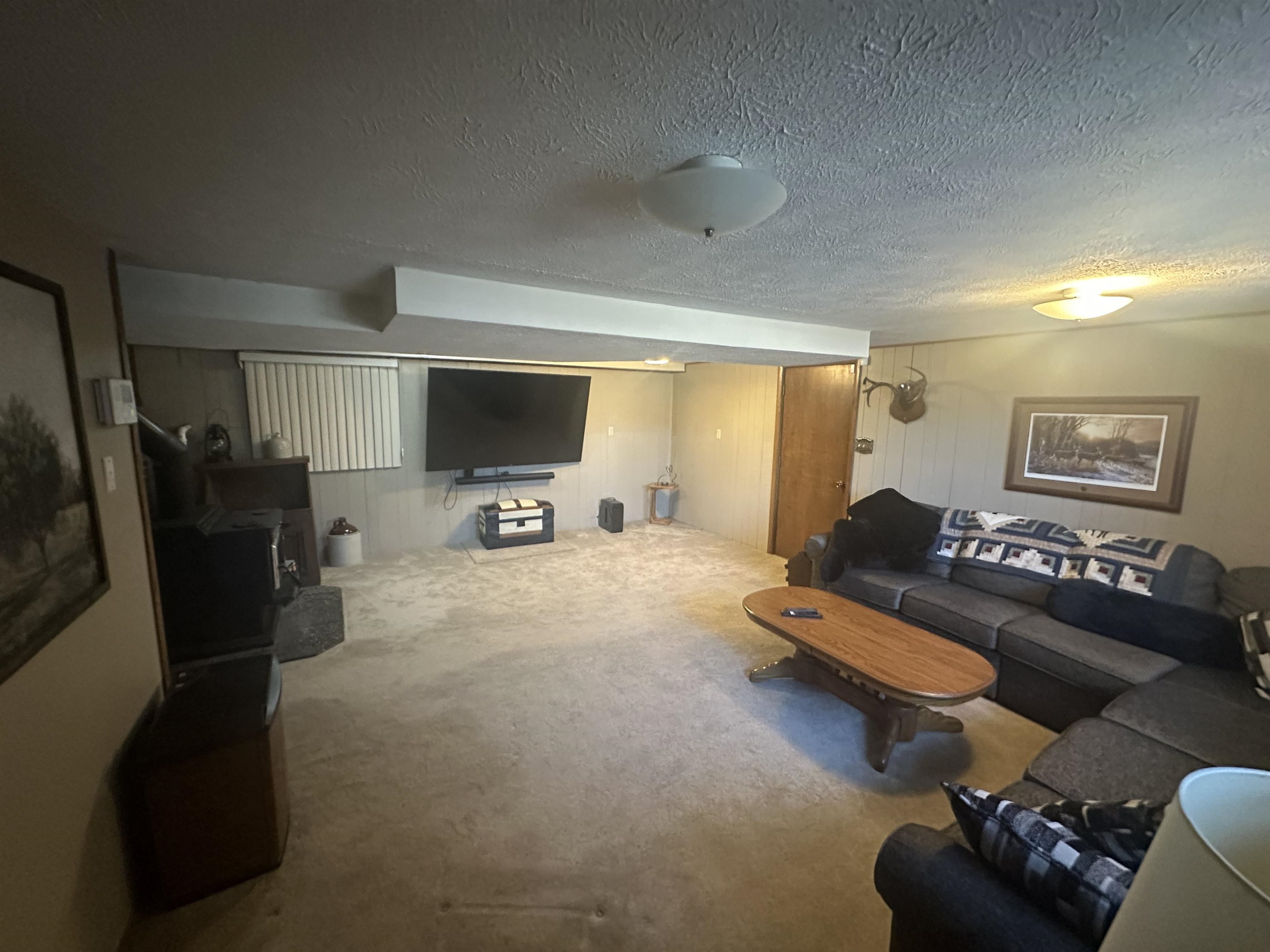 7232 Ralph Road Rockford, IL 61109 - Photo 3 of 20 a living room with furniture gym equipment and a flat screen tv
