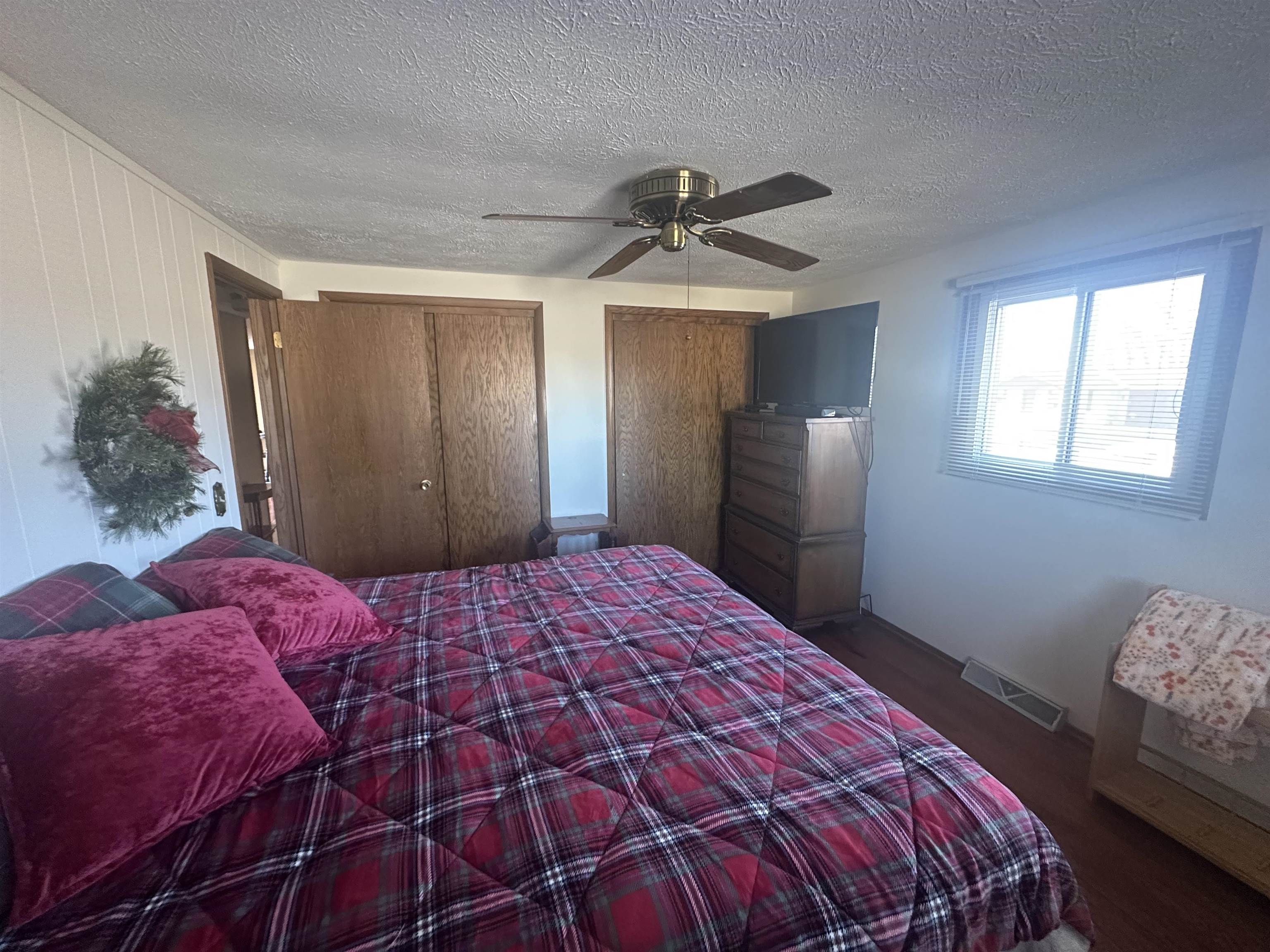 7232 Ralph Road Rockford, IL 61109 - Photo 10 of 20 a bedroom with a bed and a chandelier