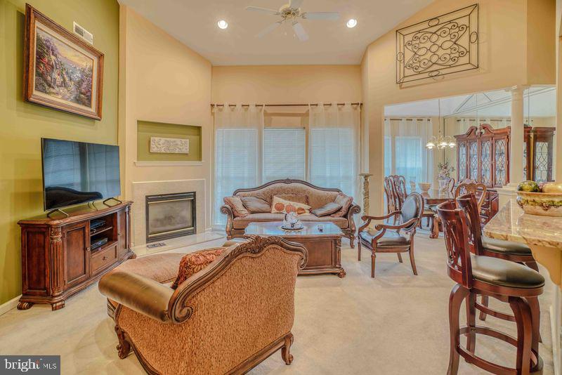 200 Beech Boulevard, Unit 301 Warrington, PA 18976 - Photo 12 of 42 a living room with furniture a flat screen tv and a fireplace