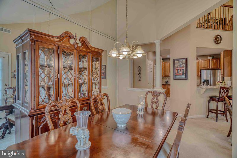200 Beech Boulevard, Unit 301 Warrington, PA 18976 - Photo 13 of 42 a view of a dining room with furniture and chandelier
