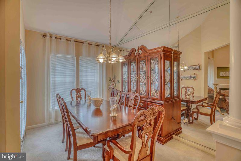 200 Beech Boulevard, Unit 301 Warrington, PA 18976 - Photo 15 of 42 a view of a dining room with furniture and chandelier