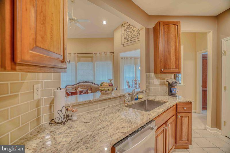 200 Beech Boulevard, Unit 301 Warrington, PA 18976 - Photo 16 of 42 a bathroom with a granite countertop sink and a mirror