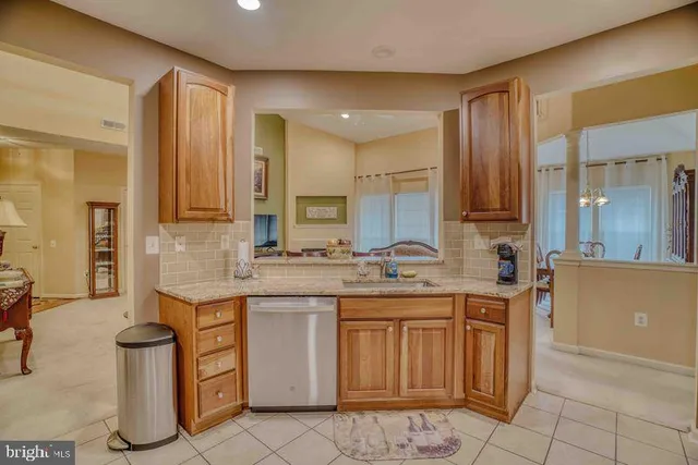 a kitchen with a sink cabinets and window