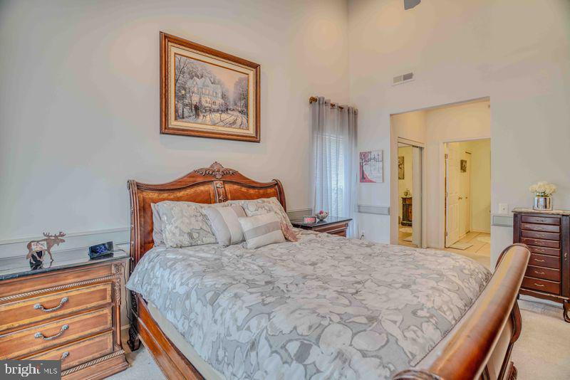 200 Beech Boulevard, Unit 301 Warrington, PA 18976 - Photo 22 of 42 a bedroom with a bed and a dresser in it