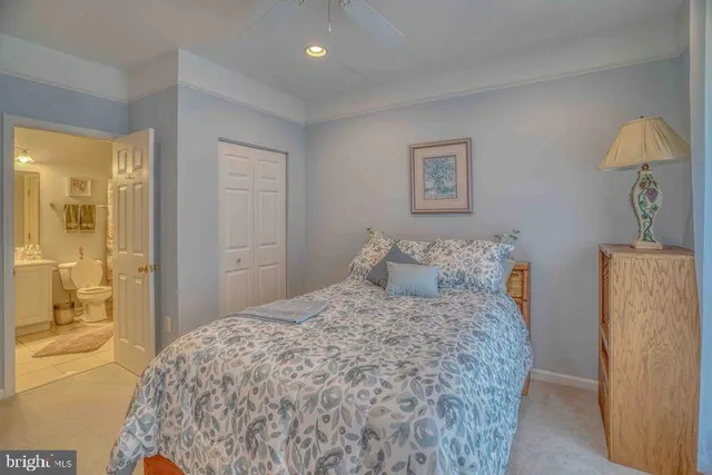 a bedroom with a bed and a view of bathroom