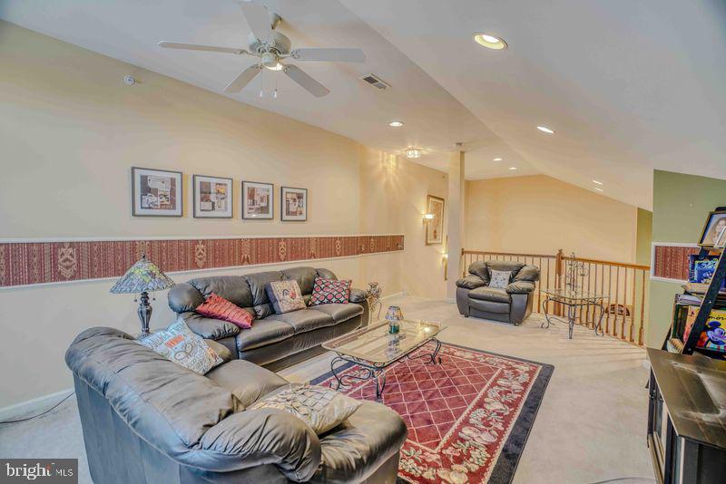200 Beech Boulevard, Unit 301 Warrington, PA 18976 - Photo 33 of 42 a living room with furniture and a rug