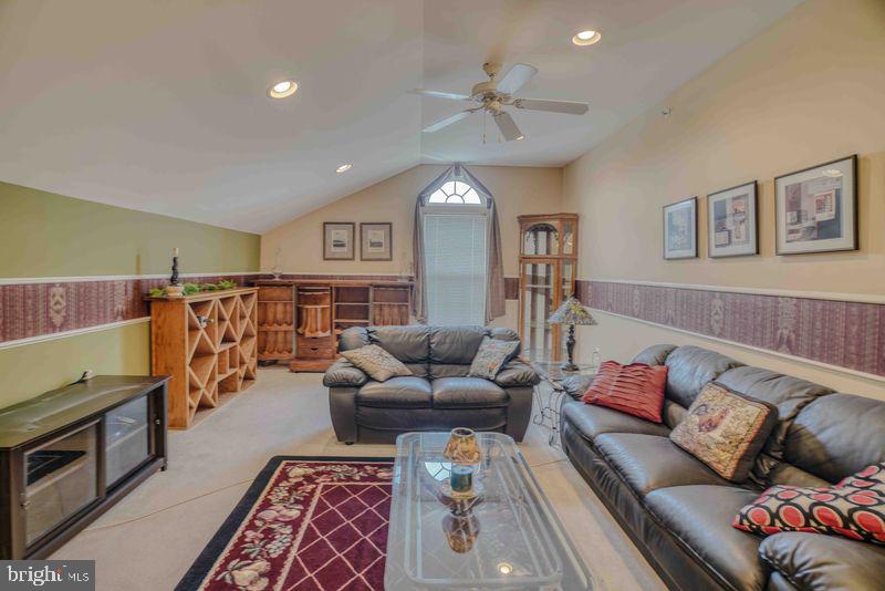 200 Beech Boulevard, Unit 301 Warrington, PA 18976 - Photo 36 of 42 a living room with furniture and a flat screen tv