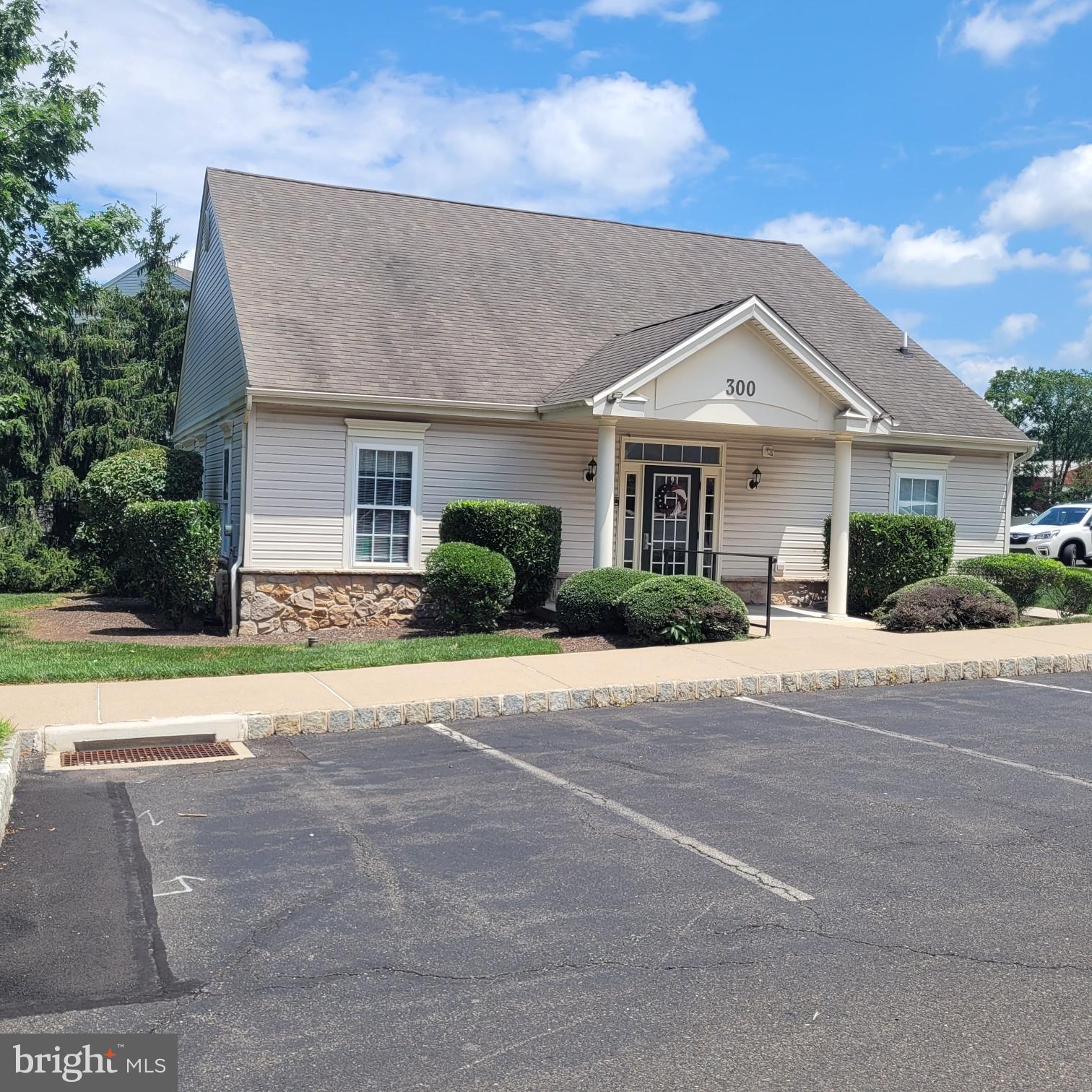200 Beech Boulevard, Unit 301 Warrington, PA 18976 - Photo 39 of 42 a front view of a house with a yard and garage