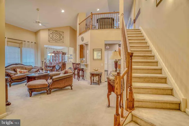 a view of staircase with furniture and stairs