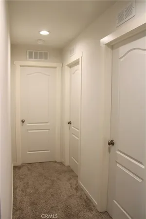a bathroom with a toilet a sink and a mirror